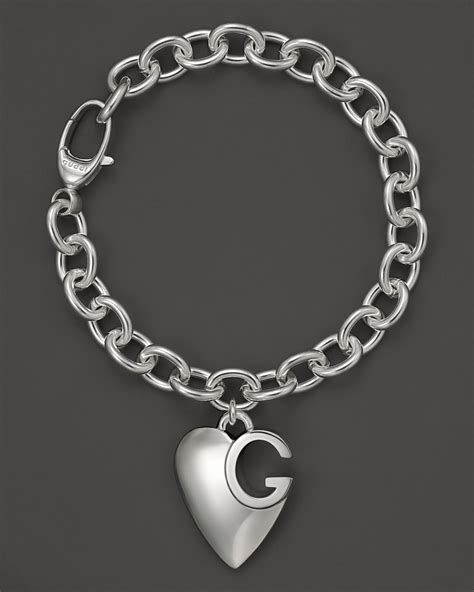 gucci bracelet gold heart|Gucci sterling silver charm bracelet.